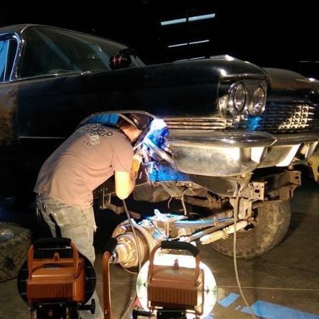 Justin welding a car